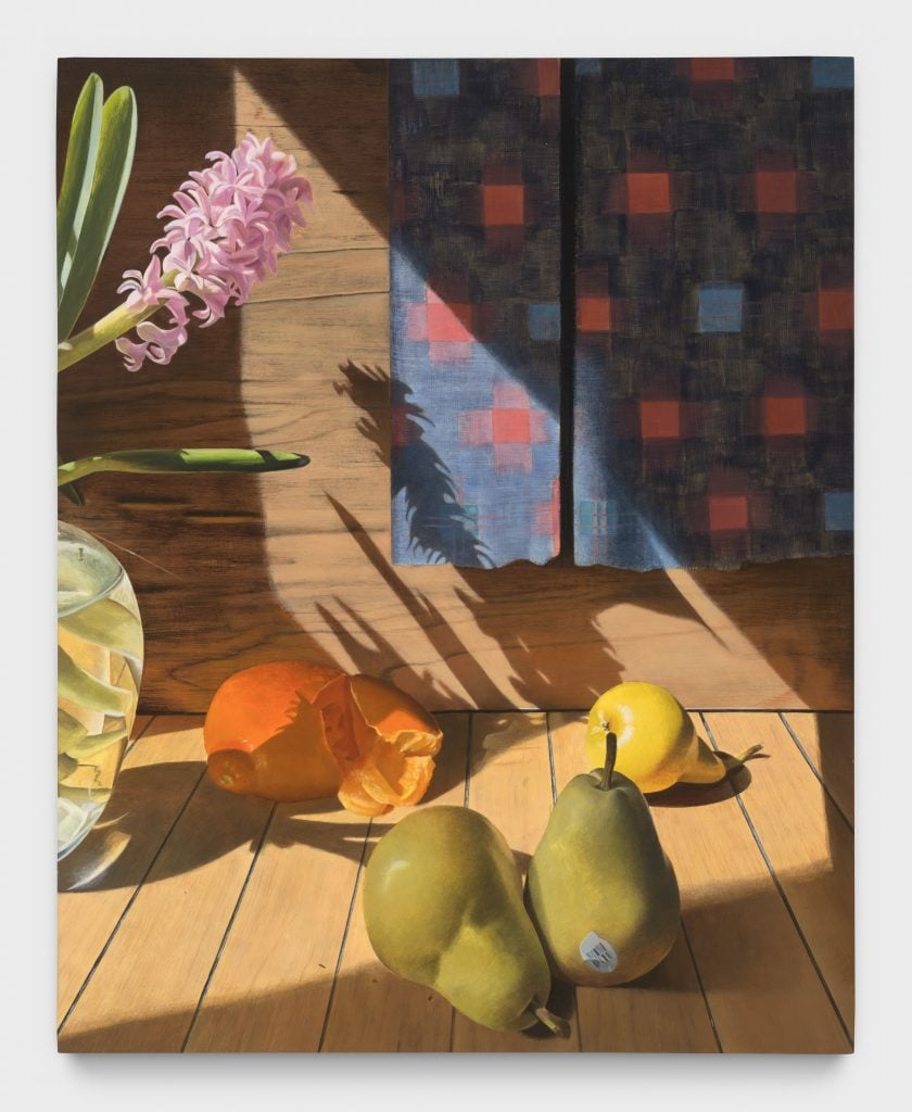 a still life of pears, an orange, and hyacinths, with a plaid fabric visible in the back