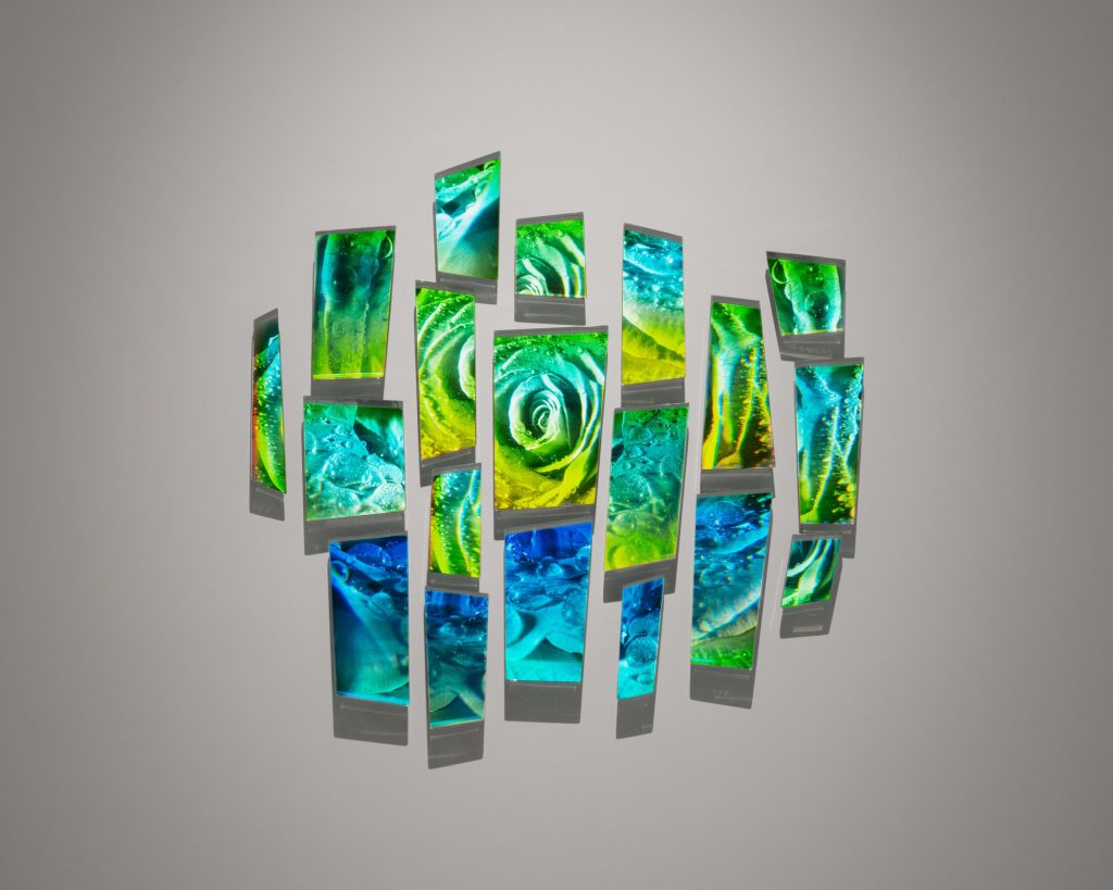 an image of a wall-hung work made of Holograms, mirrored glass, and aluminum