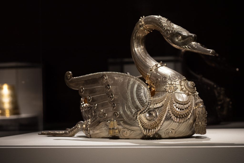 an intricate silver swan