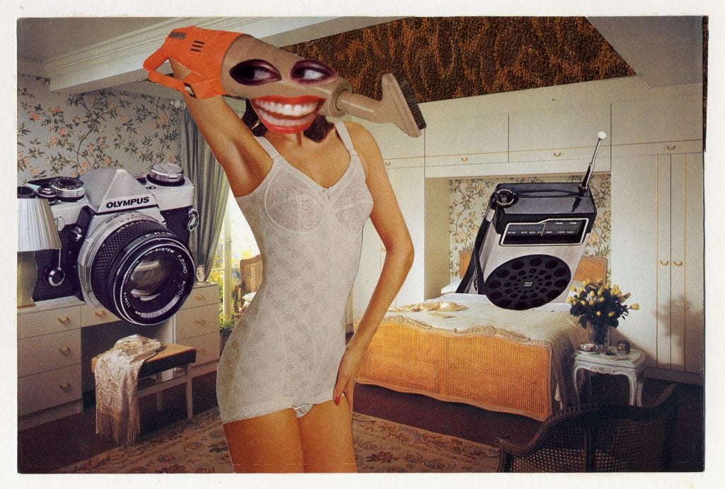 a partially dressed woman in a vintage bedroom setting has a cleaning device for a head with absurdly big eyes and mouth pasted over the top to signal it is her head, two large cameras hover on either side of her