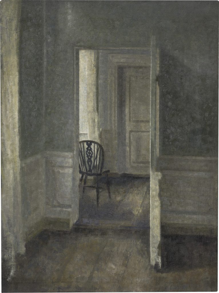 an image of a room with a chair visible in the next room