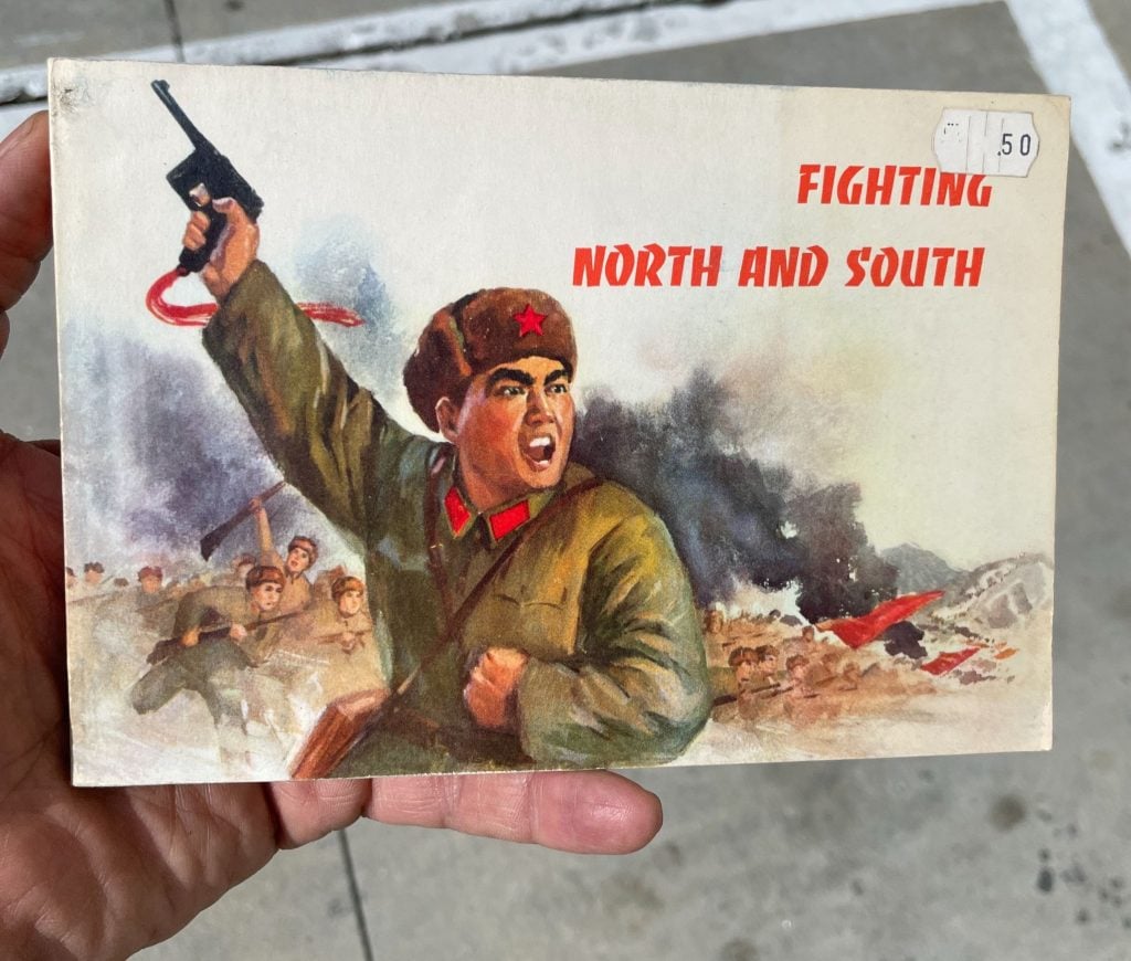 A postcard with a gun-toting man and the text "fighting north and south"