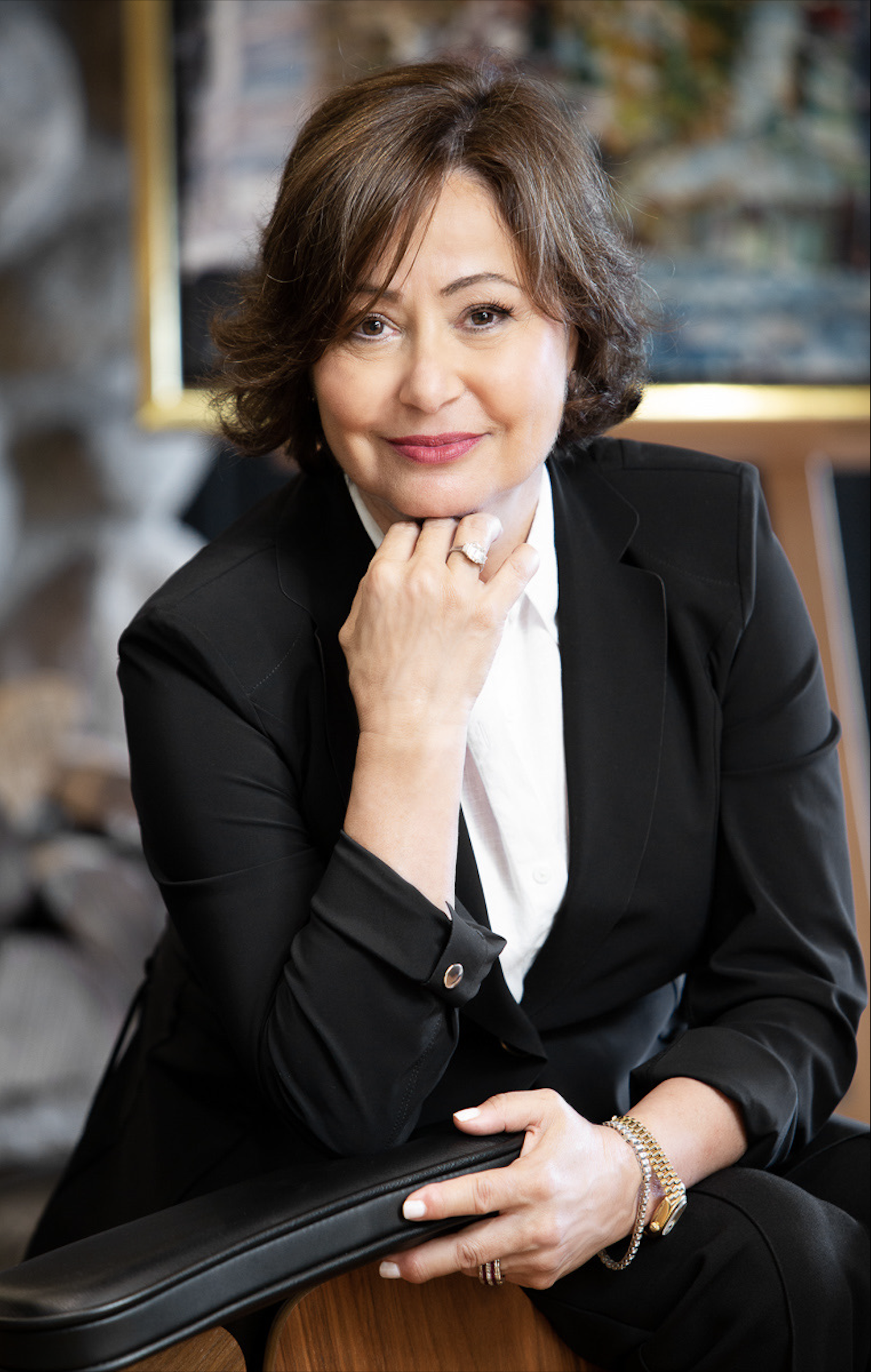 Portrait of Robin Rosenberg wearing a white shirt and black blazer.