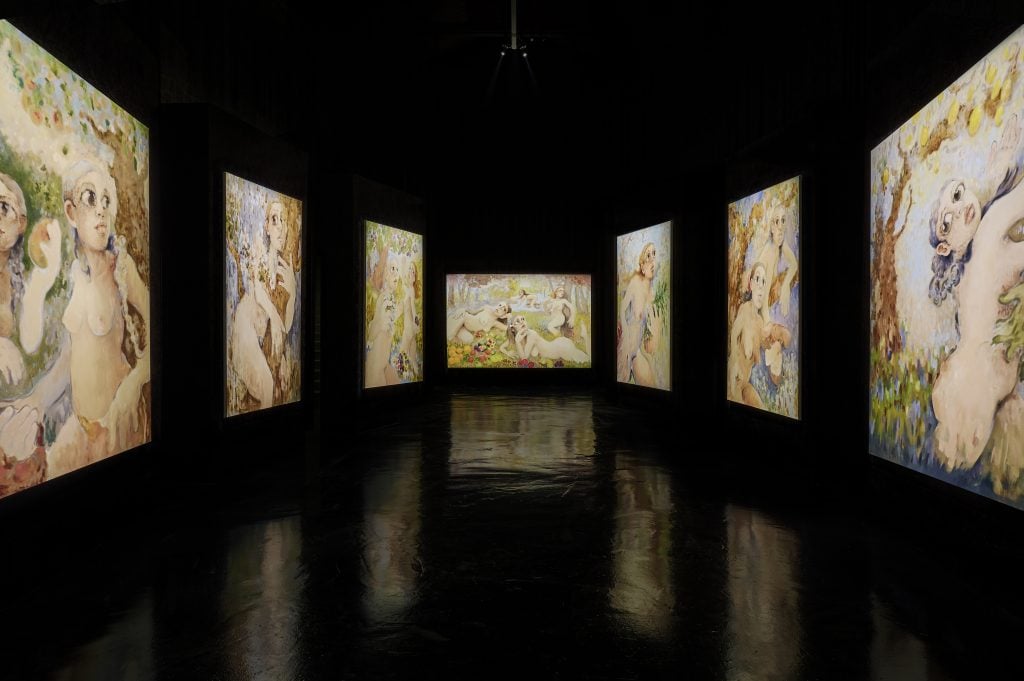Fundación La Nave Salinas installation view of large-scale figurative abstract paintings illuminated and reflecting on the black glossy ground.