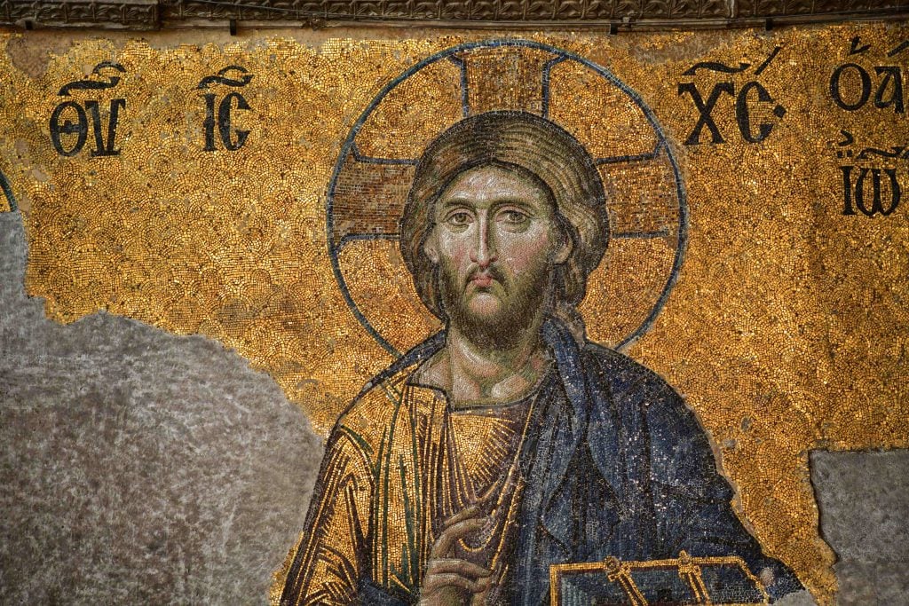 A 13th-century mosaic of gold and blue titles depicting Jesus Christ