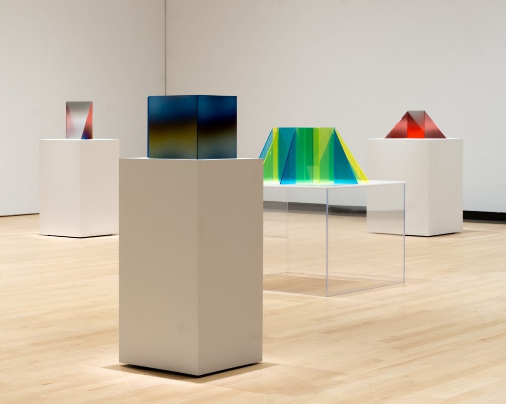 photograph of different glass sculptures on pedestals