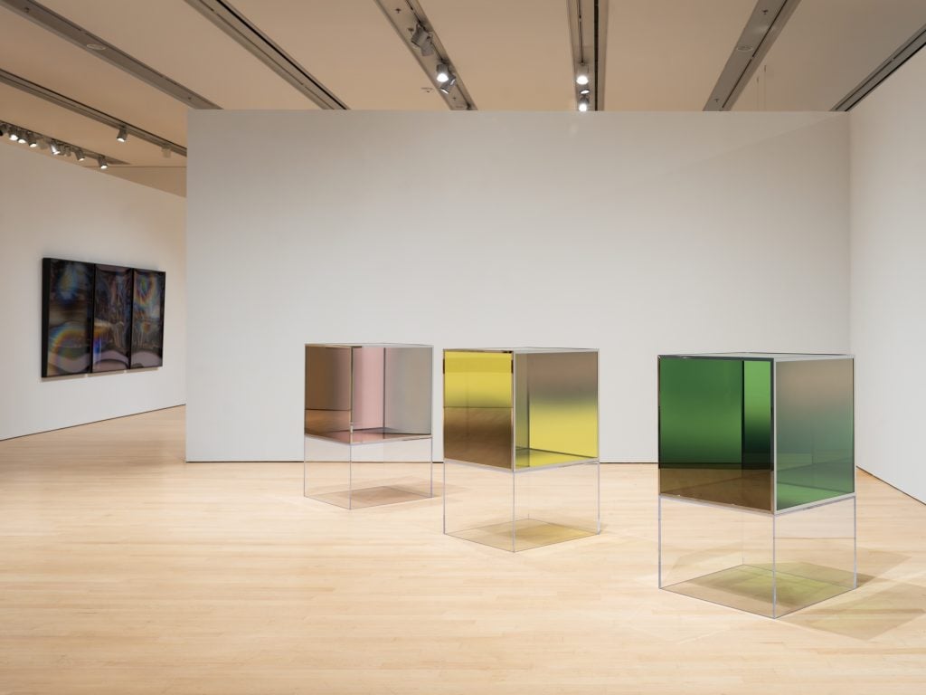 photograph of different colored glass cube sculptures