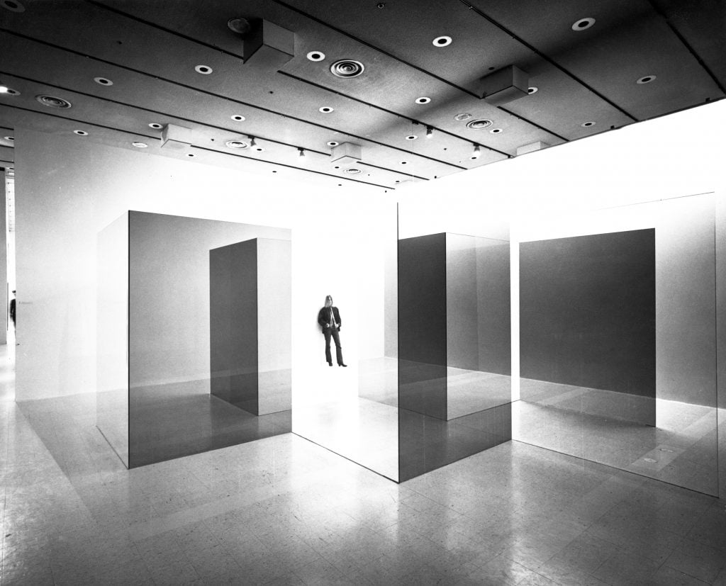 black and white photograph of glass panels installed in a gallery