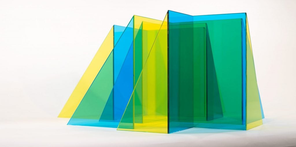 photograph of yellow and blue glass sculpture by larry bell