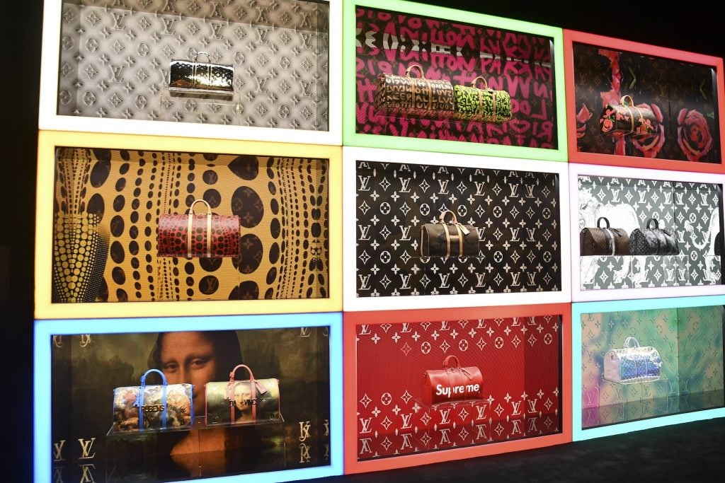 A wall of displaying multi-colored Louis Vuitton bags