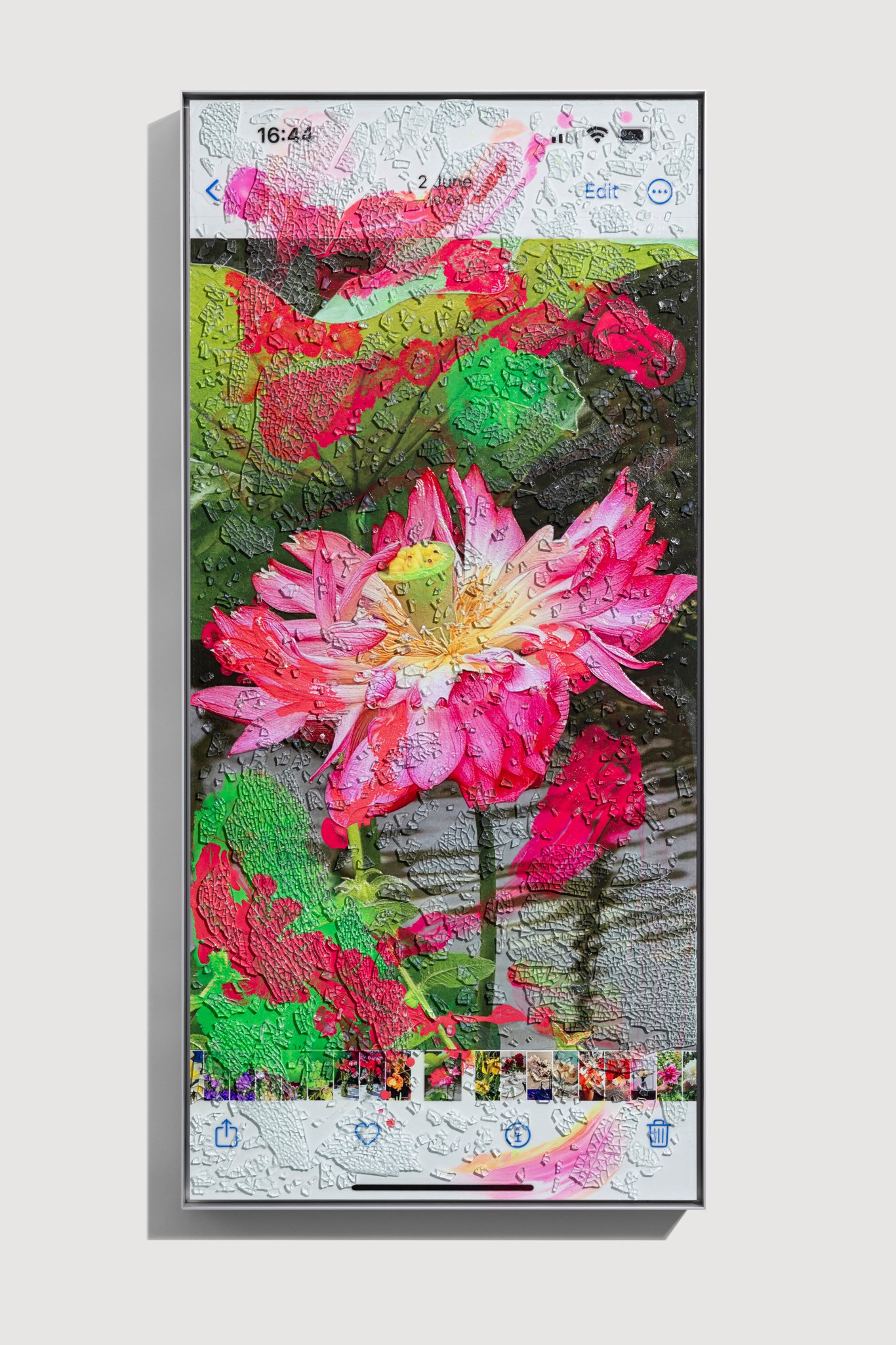 View of limited edition print by marc quinn framed in steel frame, featuring a screenshot view on an iphone of a lotus flower that is obscured by gestural swathes of color and make textural through the addition of shattered windshield glass.