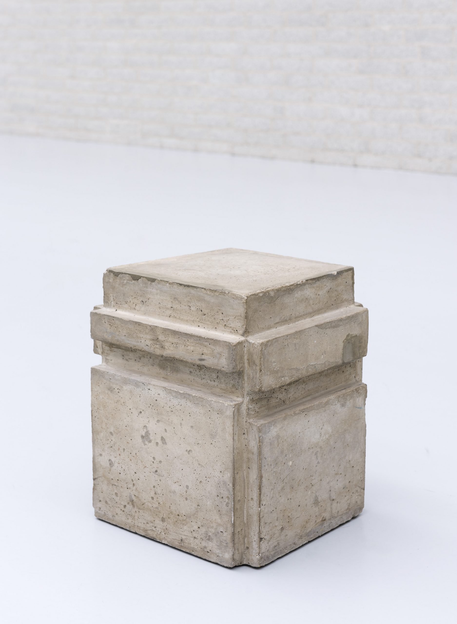 A square stone sculpture by Bruce Nauman