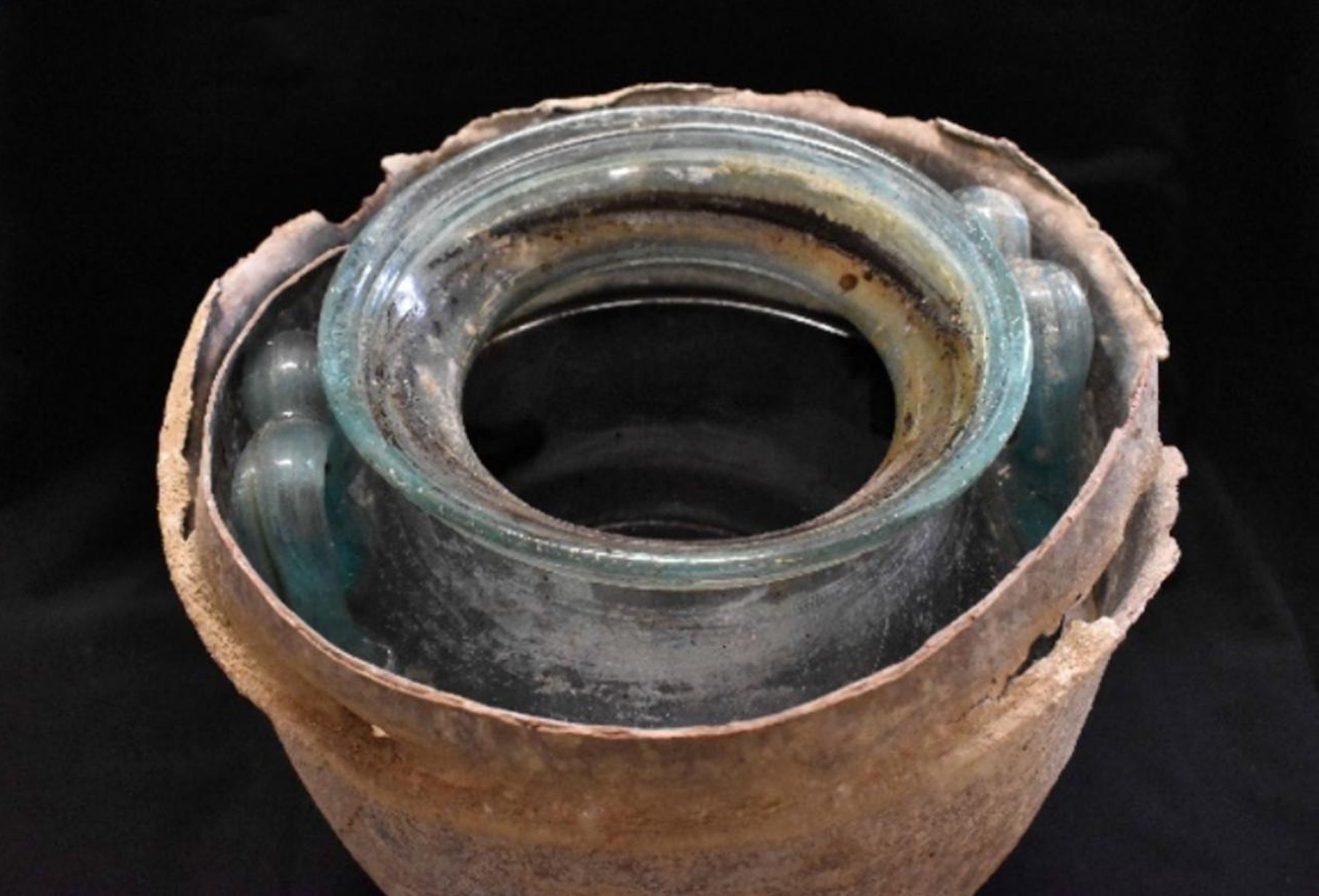 An ancient glass jar opened at the top