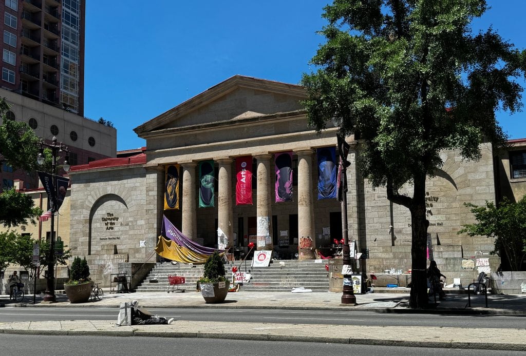 The University of the Arts building in Philadelphia covered in protest signs