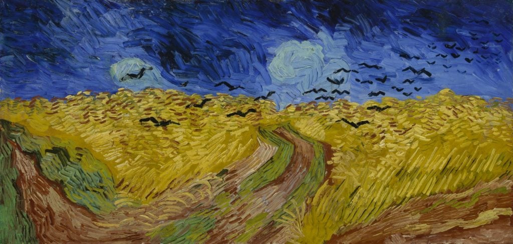Vincent Van Gogh's painting, Wheatfield with Crows, showing a golden field of wheat against a blue sky, with a flock of crows in flight.