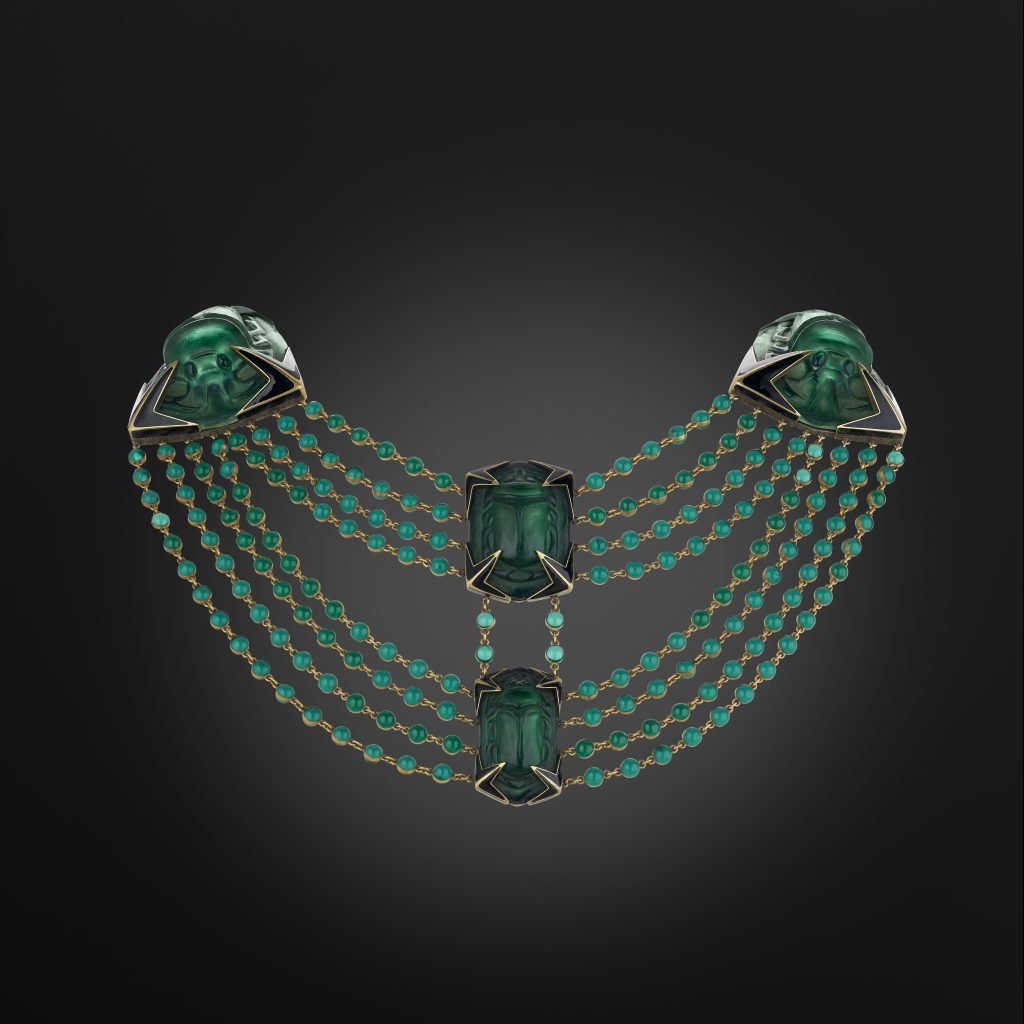 A lalique green necklace with beatle being shown at the treasure house fair