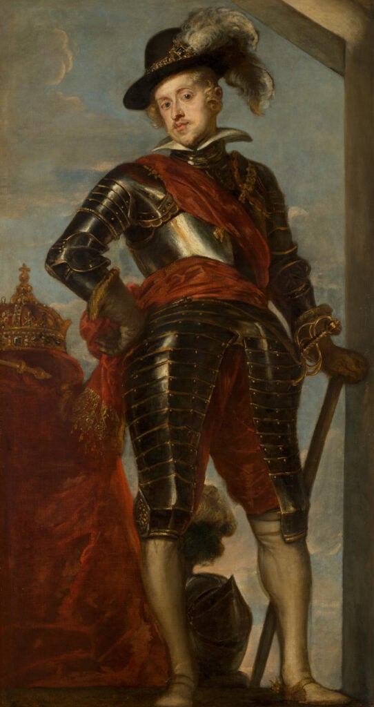 : A portrait of King Philip IV of Spain, dressed in elaborate armor with a red sash, standing confidently with a hand on his hip and a feathered hat.
