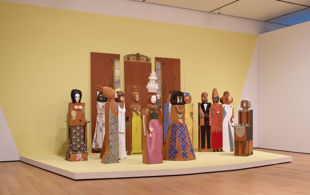 "Marisol: A Retrospective," installation view at the the Buffalo AKG Art Museum with <em>The Party</em> (1965–66). Photo by Brenda Bieger, courtesy of the Buffalo AKG Art Museum. 