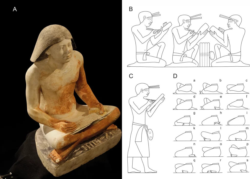 An ancient egyptian statue of a seated scribe, carved from sand coloured stone