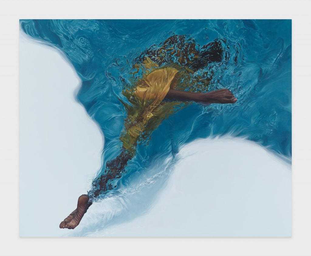 a black woman wearing a yellow dress is seen submerged in a pool of water