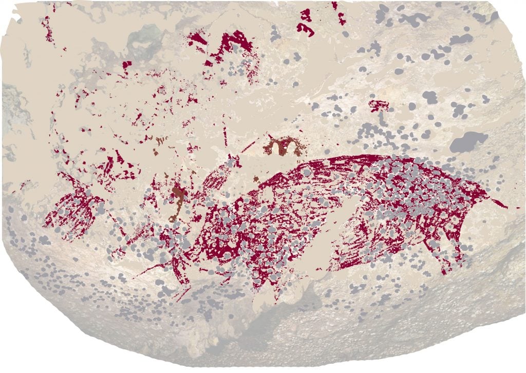 a digital image of a knobbly surface resembling a rock with the vague silhouette of a wild boar in red and some more red markings that could be human figures scattered to the left side