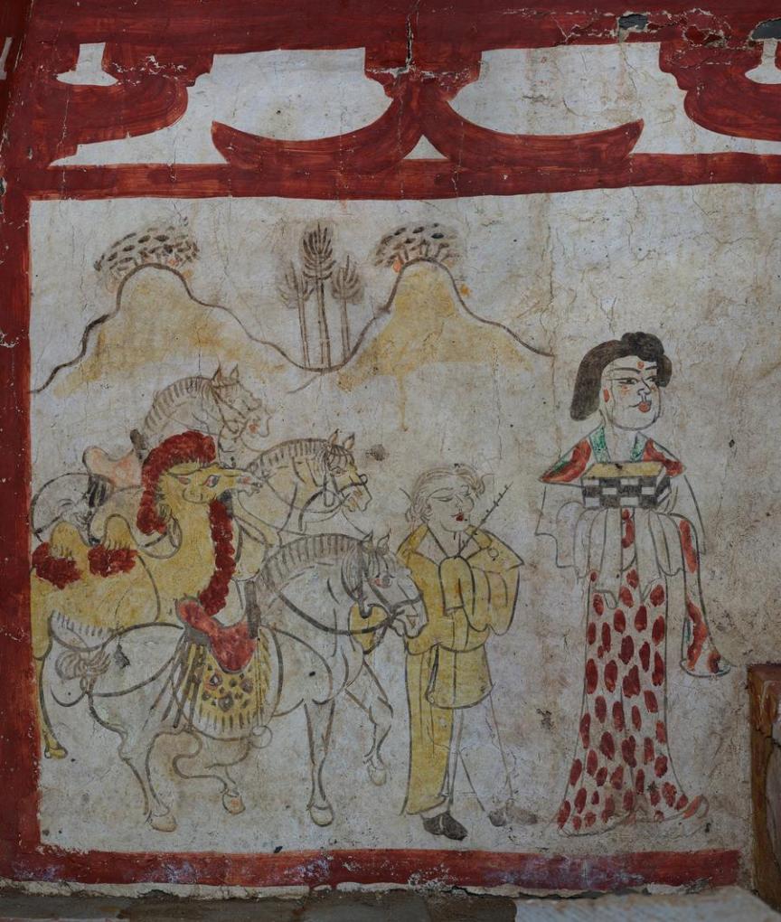 The panel on the eastern wall portrays a woman in a vibrant gown, with a robed man behind her, guiding horses and camels by their reins.