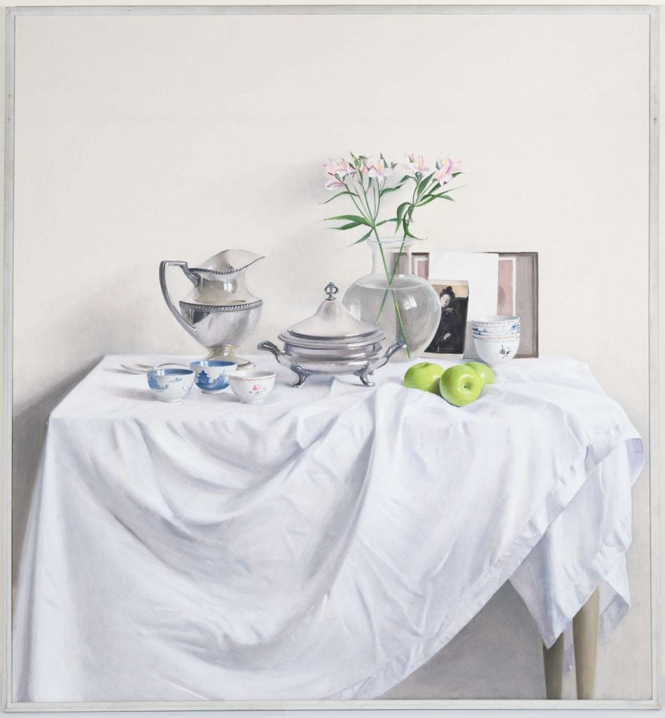 A realistic painting of a table setting with a white tablecloth, silverware, and green apples, emphasizing light and shadow.