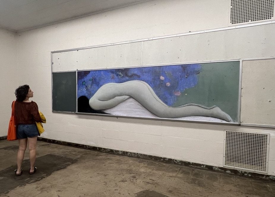 8-foot-wide pastel on chalk board of a nude as seen from above