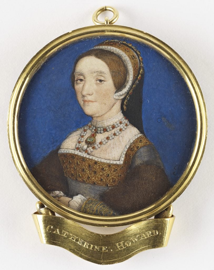 an old fashioned Tudor style portrait of a woman in a circular gold frame with "catherine howard" written on it