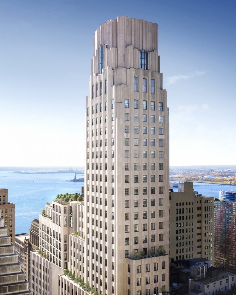 A 50-story Art Deco skyscraper set against blue skies in Lower Manhattan. 