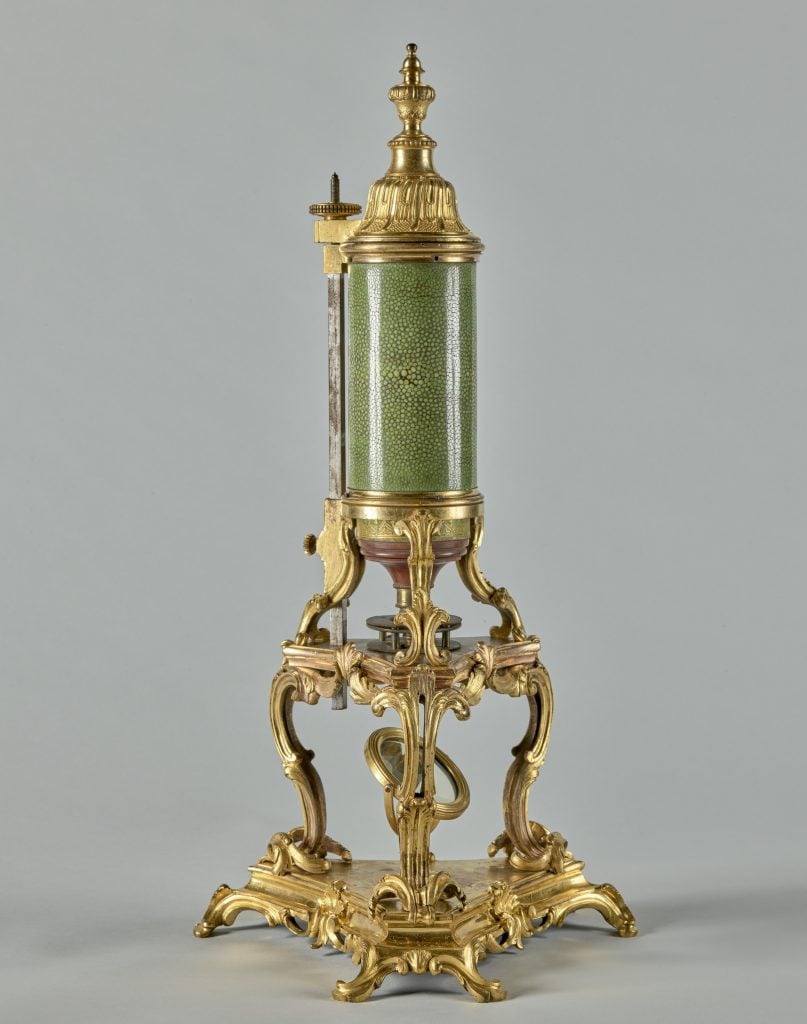 an optical microscope with a bronze stand the likes of which were given as diplomatic gifts by the French nobility.