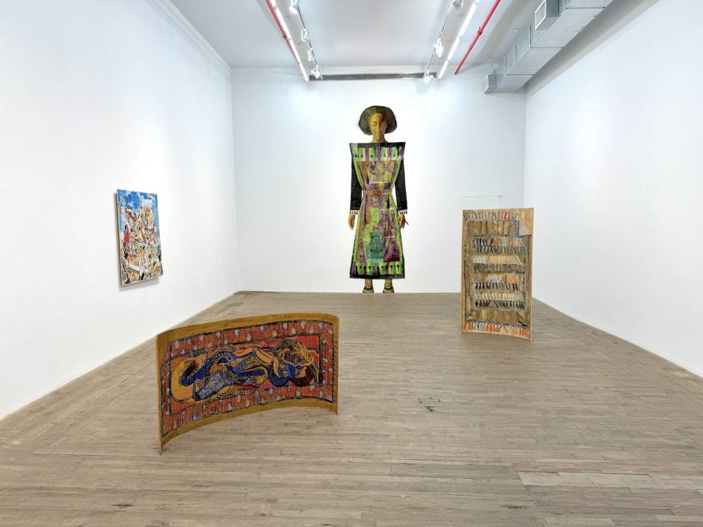 Multiple artworks displayed in a gallery
