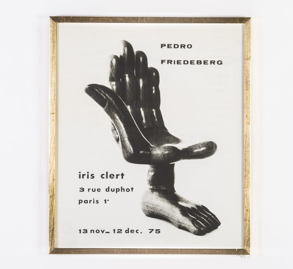 an antiwar poster depicts a chair that looks like a hand combined with a foot 