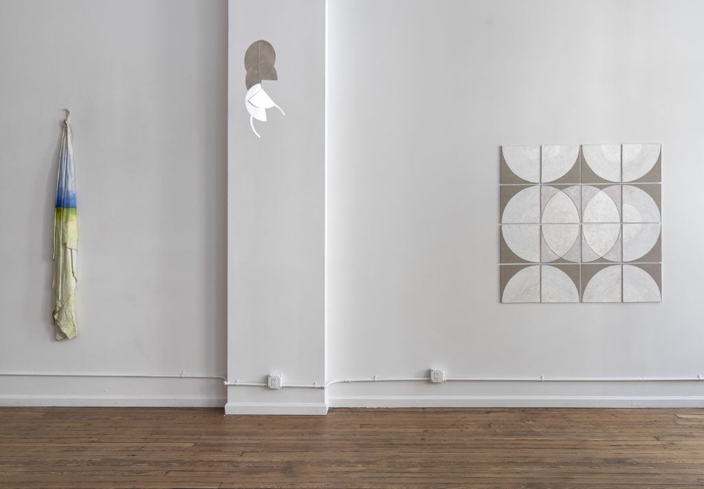 minimalist artworks installed on a gallery wall