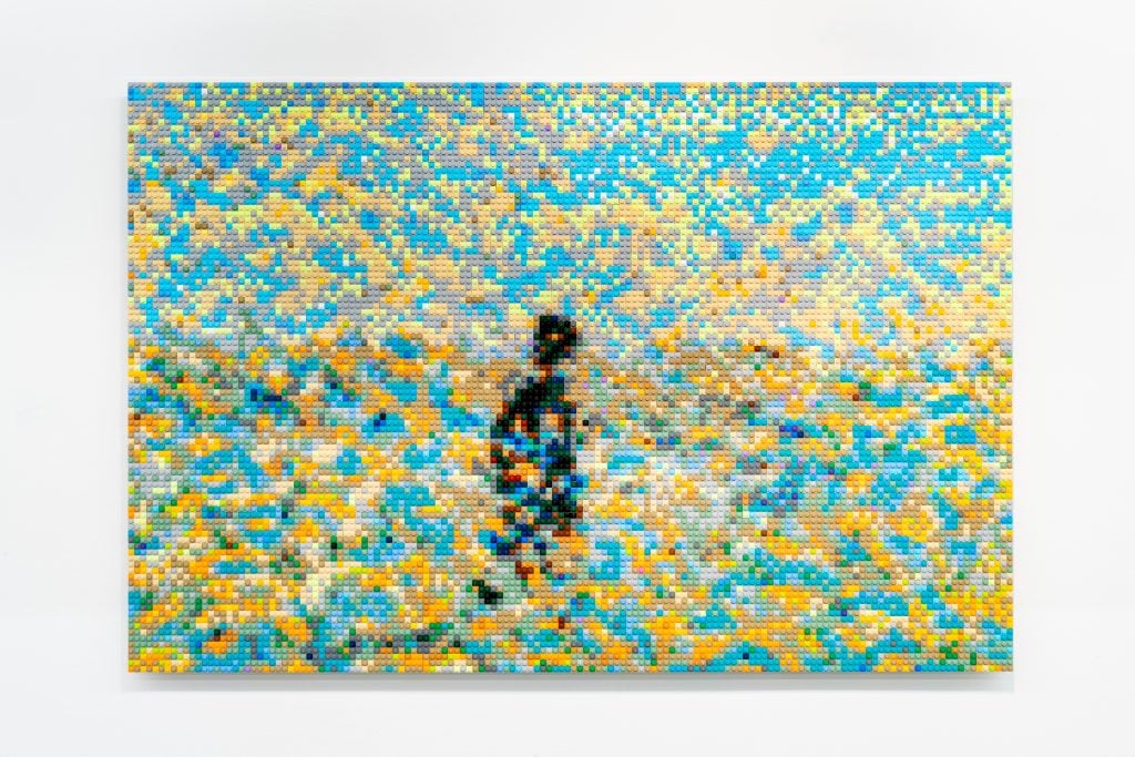 An abstract composition made entirely of legos in the color scheme of van gough, teals, yellows, and a central figure rendered in shadowy black.