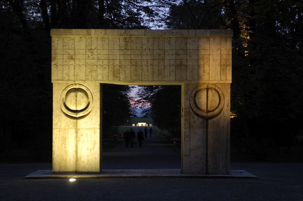 Constantin Brancusi public sculpture of a blocky marble arch, with geometric engravings