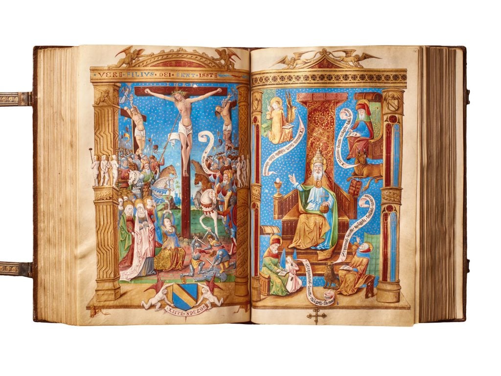 A medieval book open to a colorful illustration of the lamentation of Christ.