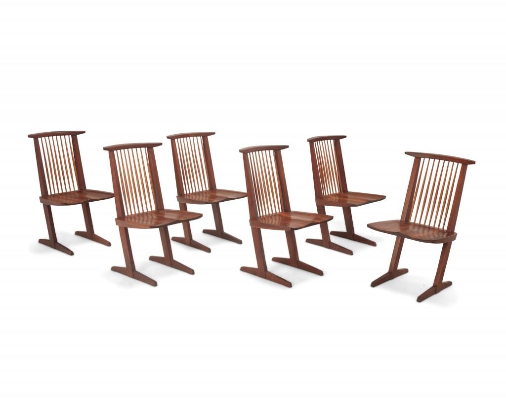 Six formed seat cantilevered chairs made from walnut.