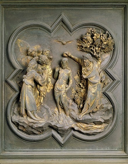 a gilt bronze panel showing the baptism of christ by john the baptist. on the left, a group of angels is jumbled together