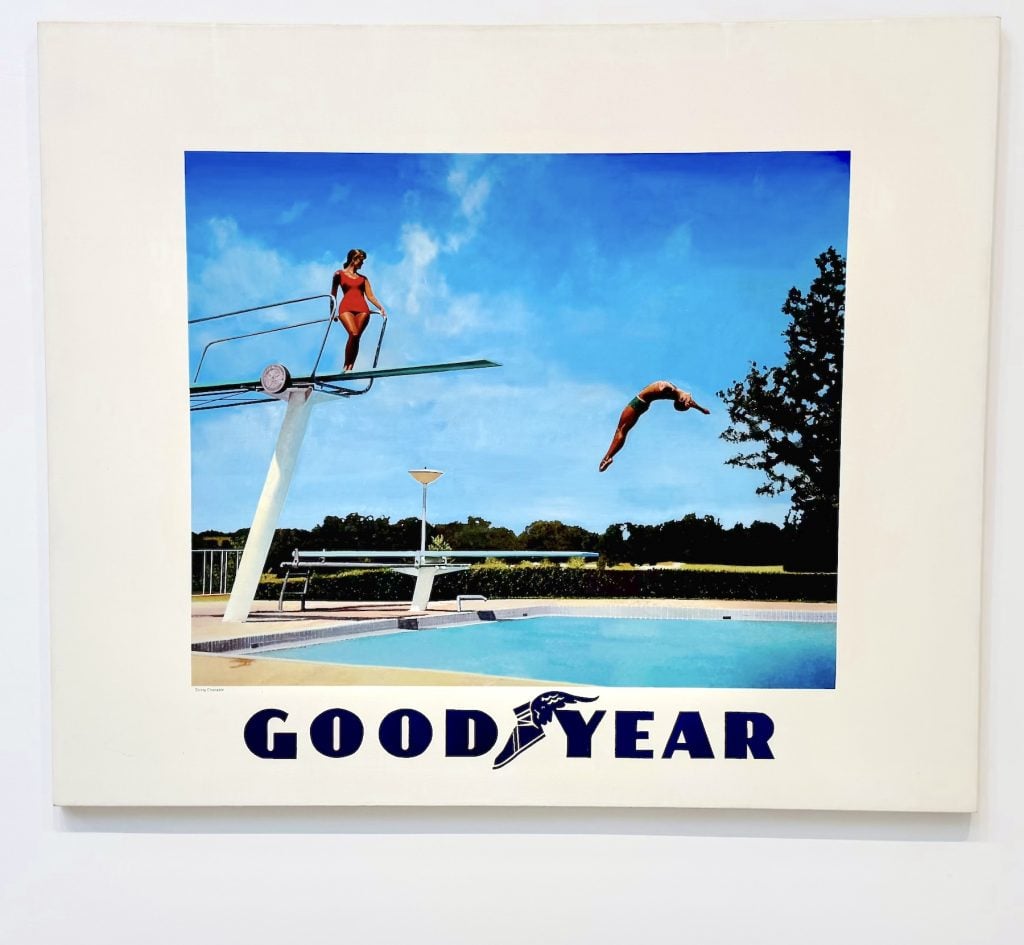 A painting of a woman on a diving board with the word GOOD YEAR below it