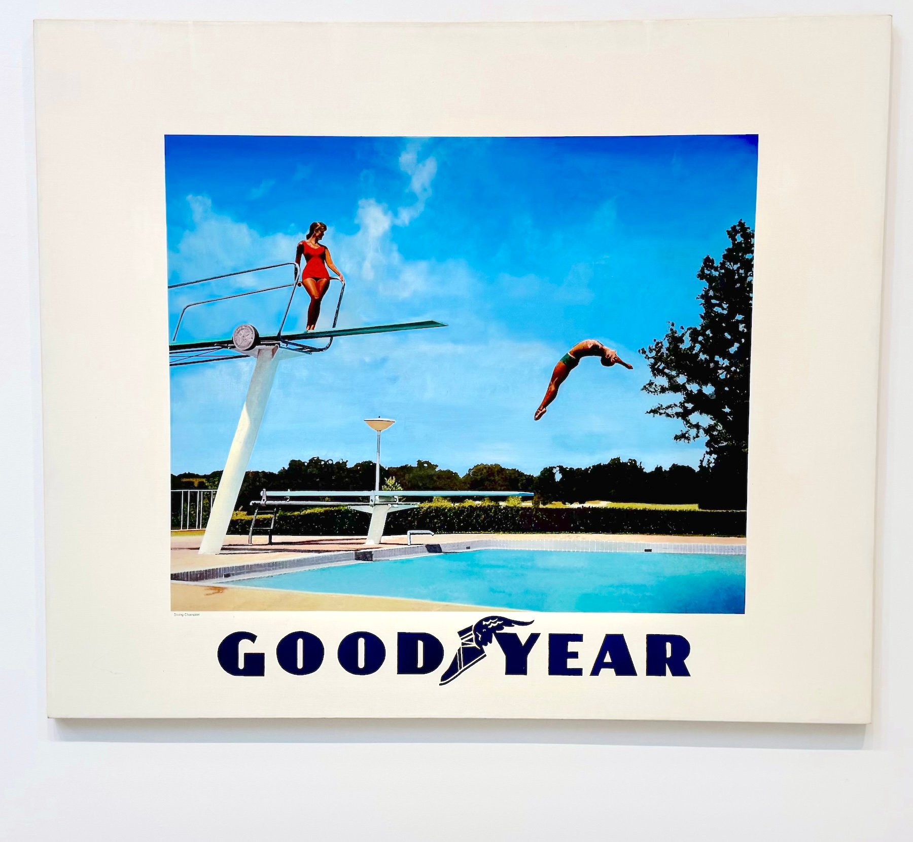 A painting of a woman on a diving board with the word GOOD YEAR below it