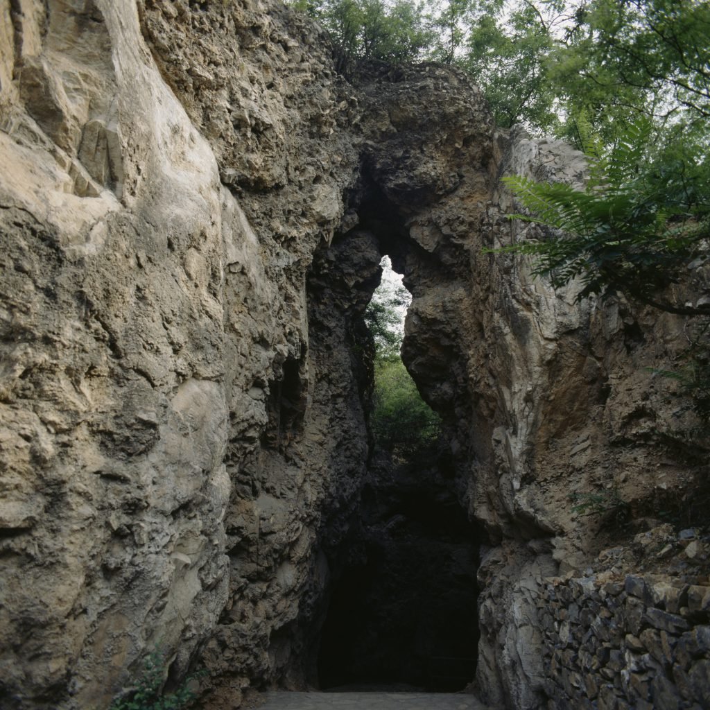 A path cut between two rock faces at the Zhoukoudian Peking Man site