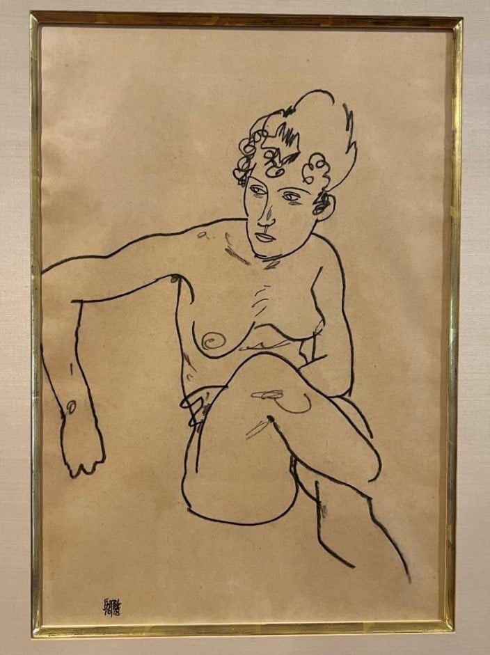 Egon Schiele drawing of a seated nude woman.