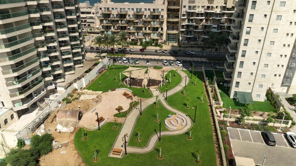 aerial view of a park with trees and buildings