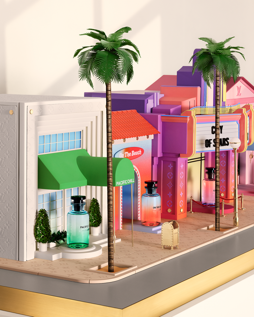 A close up view of a brightly colored diorama of an imagined, glamorous Los Angeles Street including a spa, surf shop, cinema, palm trees, and golden mailbox