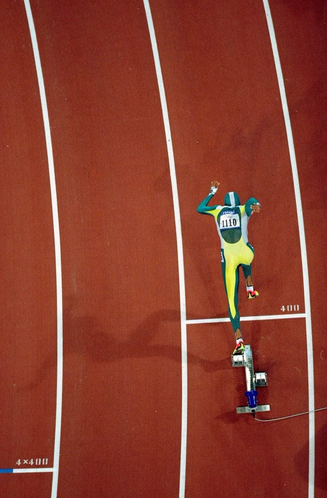 A photo shot from above of sprinter Cathy Freeman of Australia taking off on the track on her way to win gold in the womens 400 meter final