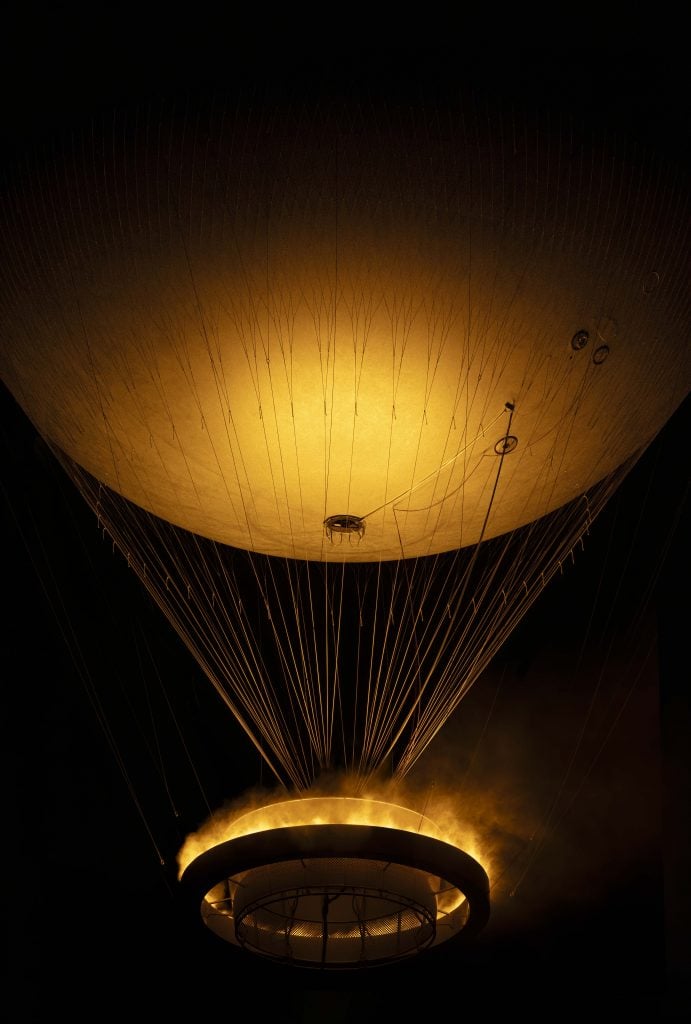 Mathieu Lehanneur, Paris 2024 Olympic Cauldron, floating in the night sky suspended from a helium balloon. 