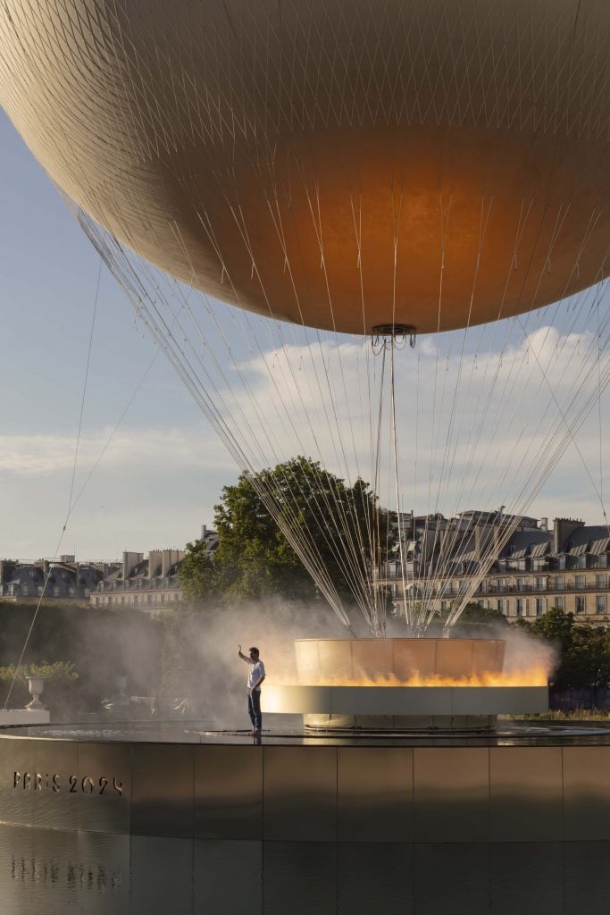 Mathieu Lehanneur with his Paris 2024 Olympic Cauldron, as seen by day in the Tuileries Garden. 