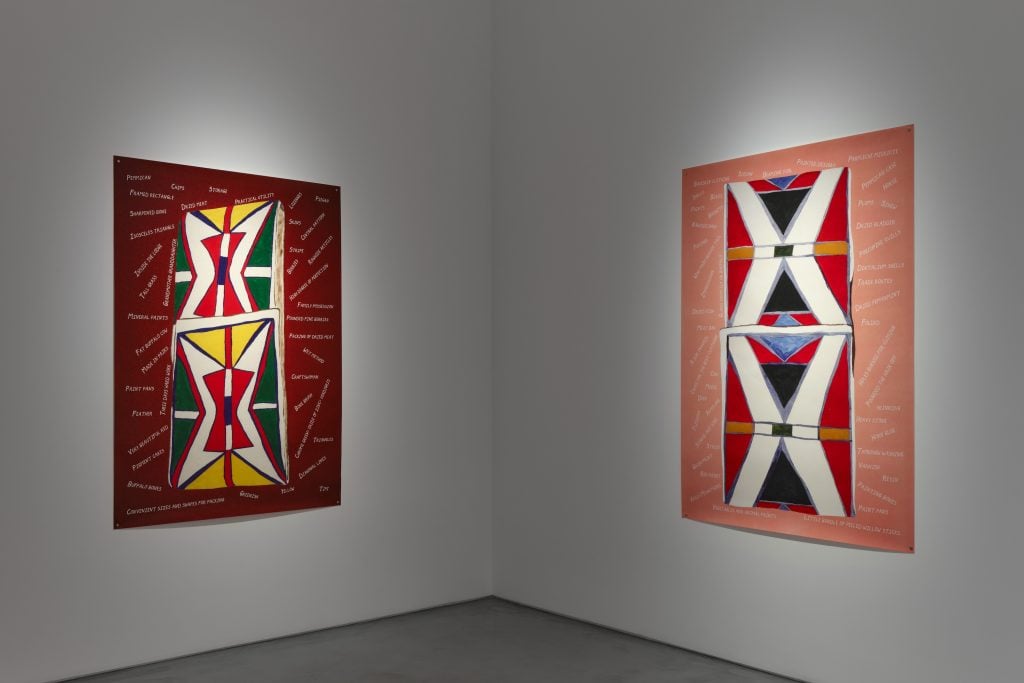 two native american designs painted in large art works