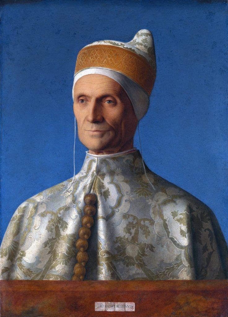 An image of an oil painting of a Catholic leader from the chest up on a blue background, painted by Giovanni Bellini